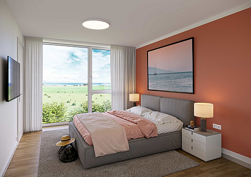 Wohlfühlschlafzimmer einer Ferienwohnung mit Meerblick